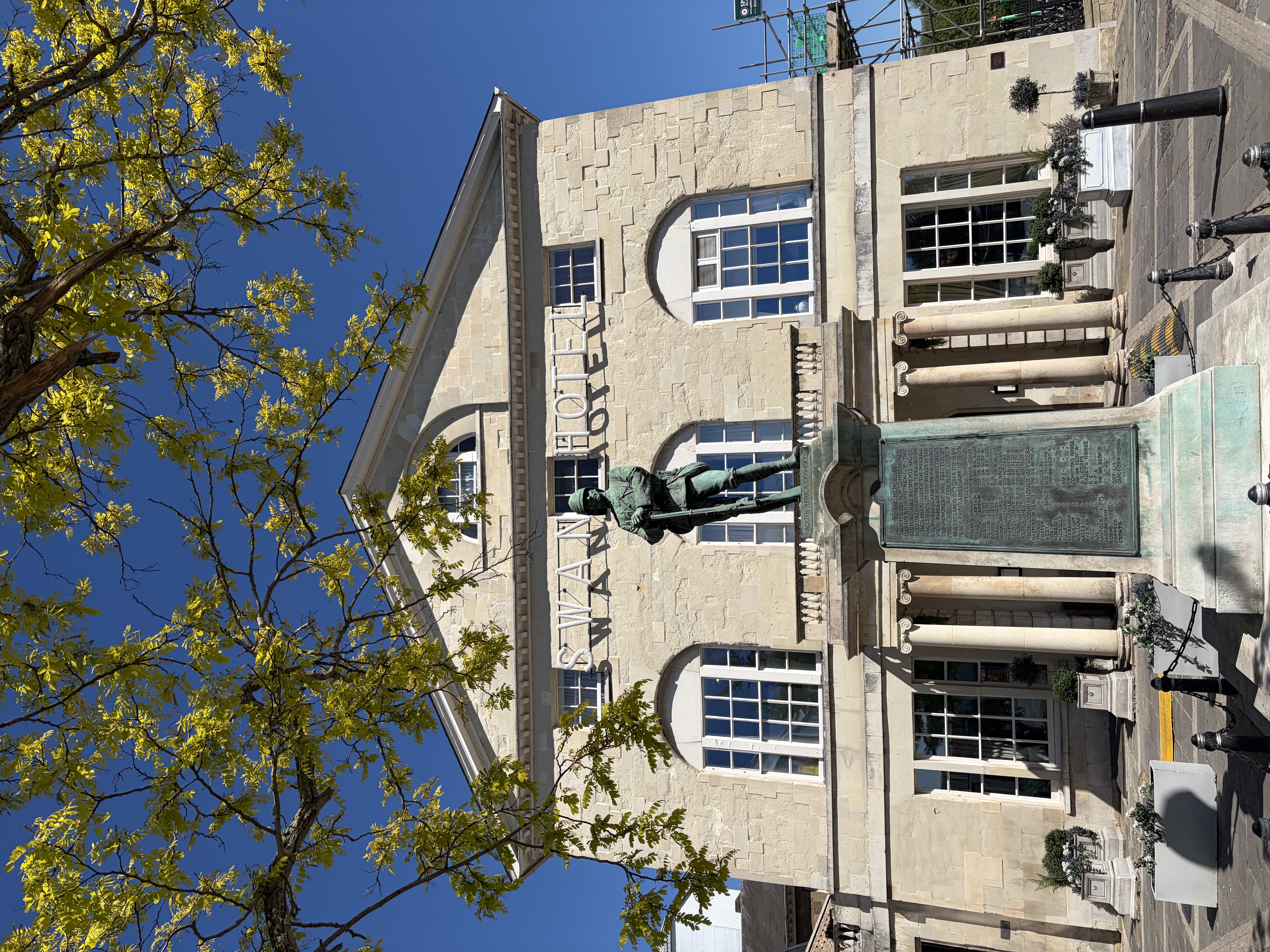 The Swan hotel and South Africa soldiers monument in the sun
